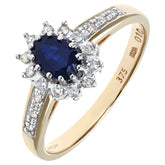 0.52ct Oval Sapphire and 0.1ct Round Diamond Cluster Ring with Side Stones in UK Hallmarked 9ct Yellow Gold